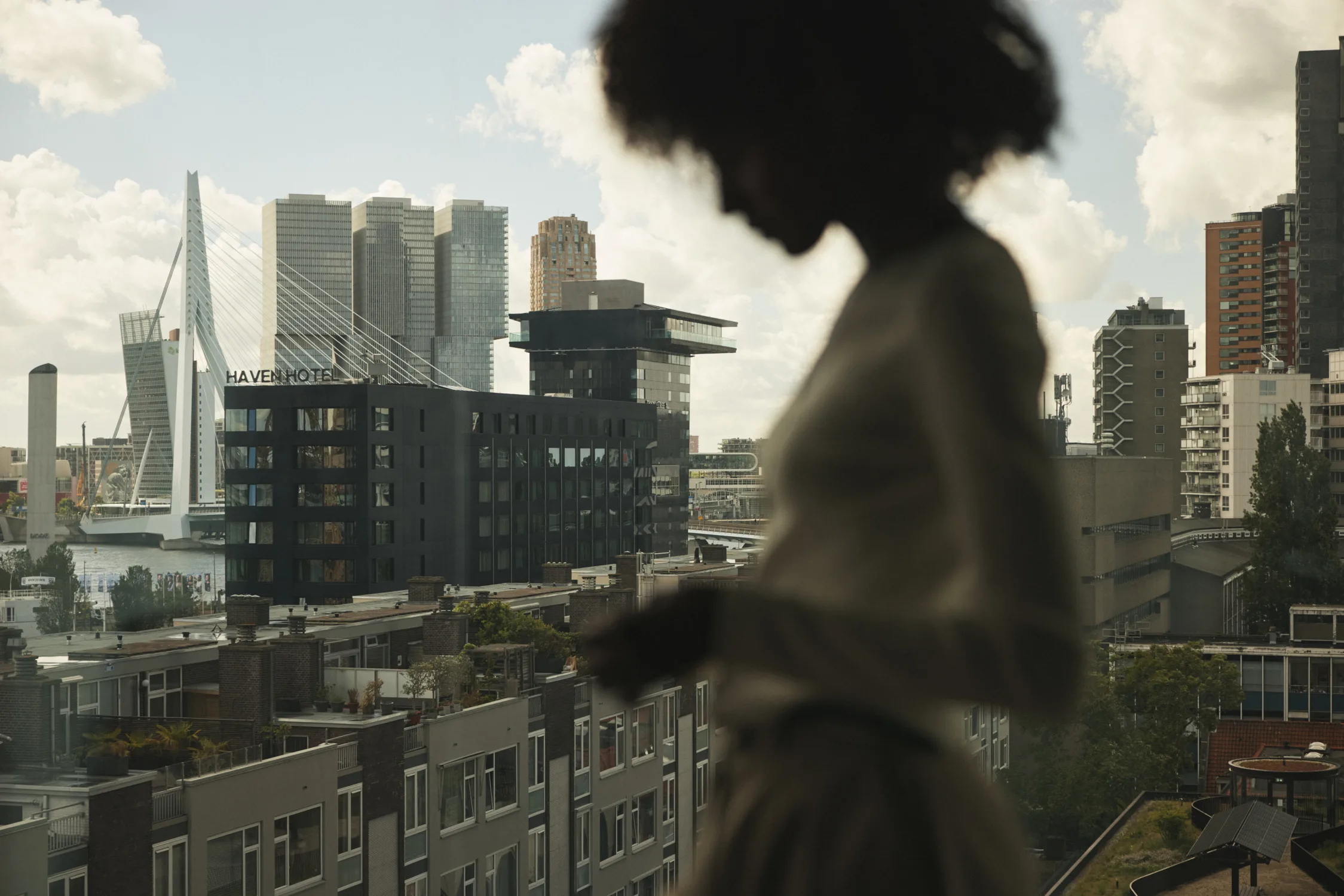 Apartment interior with panoramic city view at sunset