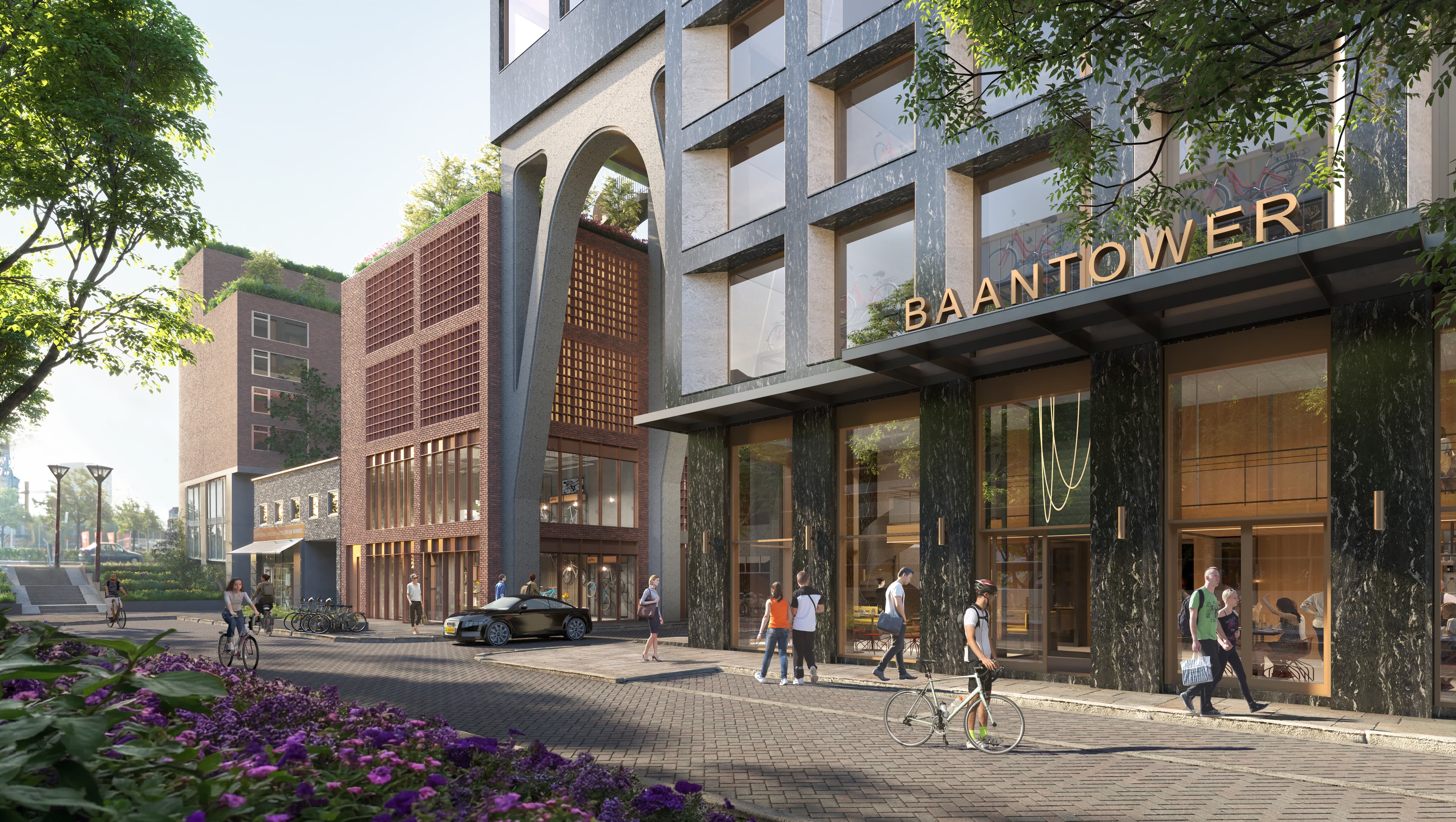 The BaanTower entrance with cyclists passing by